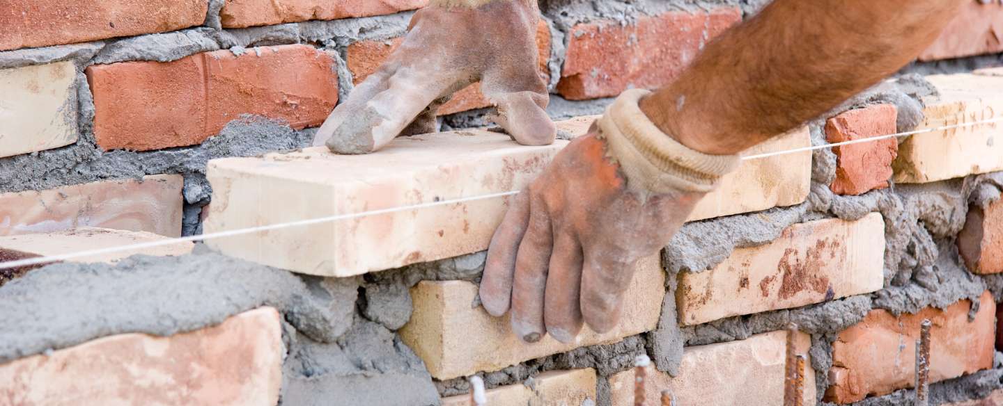 building a wall of bricks close up st louis mo